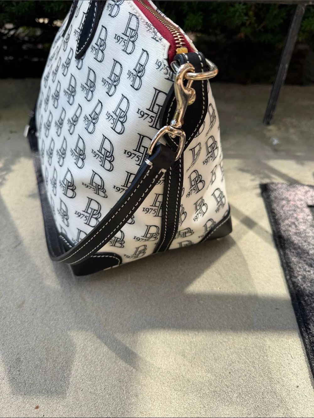 DOONEY AND BOURKE BLACK AND WHITE 1975 LOGO SATCHEL BAG